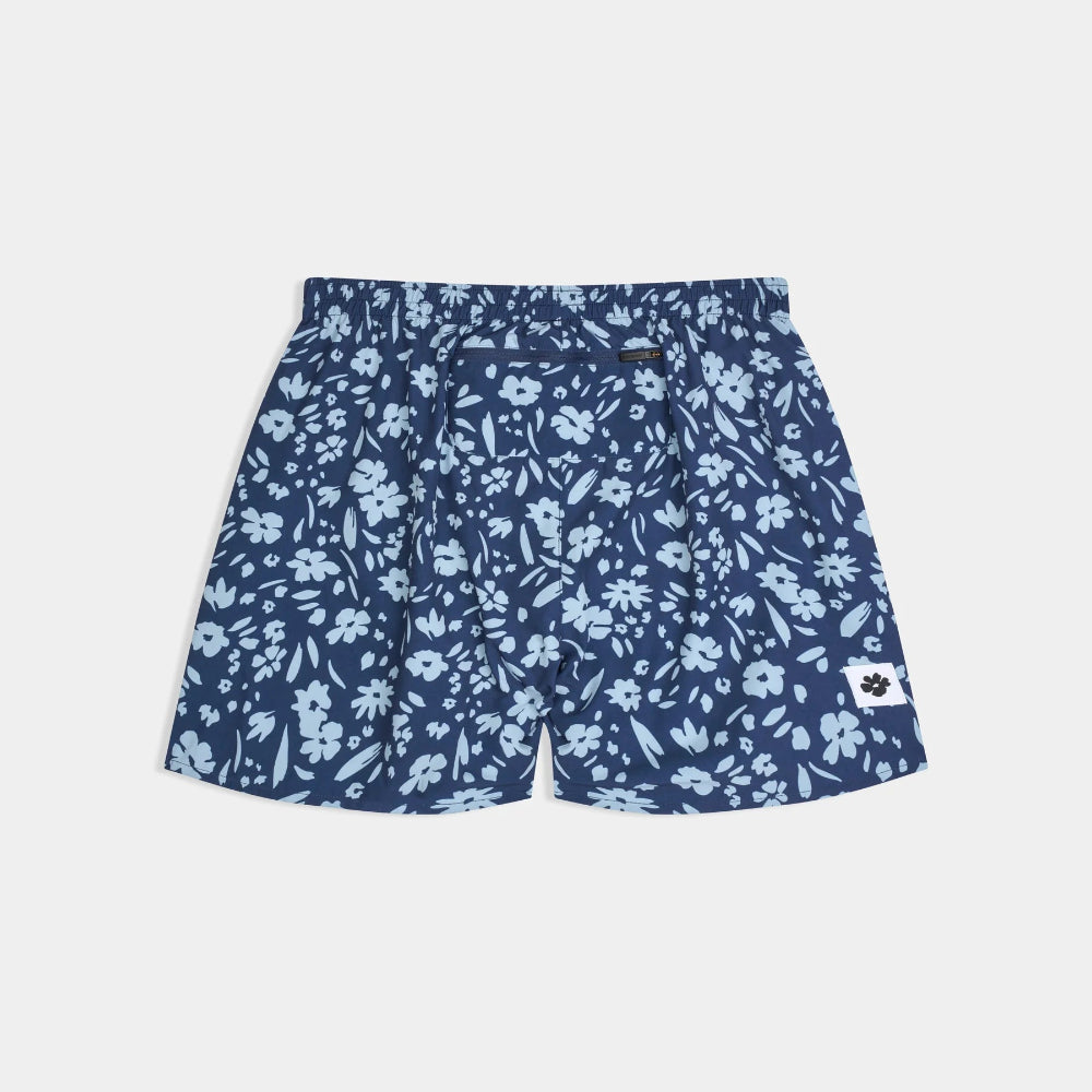 Blue floral-patterned shorts on a light gray background