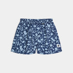 Blue floral-patterned shorts on a light gray background