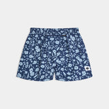 Blue floral-patterned shorts on a light gray background