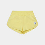 Yellow shorts with a small logo on a light gray background