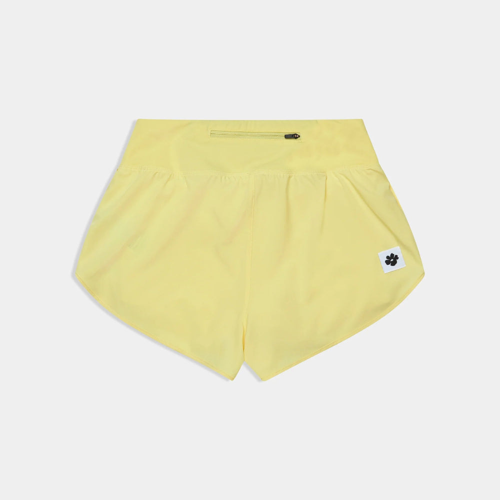 Yellow shorts with a small logo on a light gray background
