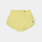 Yellow shorts with a small logo on a light gray background