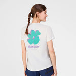Woman wearing a white t-shirt with a colorful logo and 'Saysky' text on a light gray background