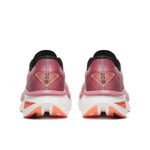 Pink running shoes with white sole on a white background