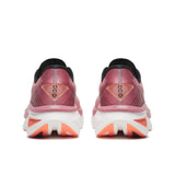 Pink running shoes with white sole on a white background