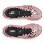 Pink running shoes with black soles on a white background