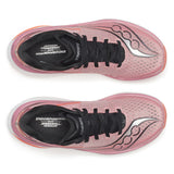 Pink running shoes with black soles on a white background