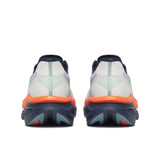 Back view of a pair of running shoes with a white background