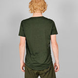 Person wearing a green t-shirt and shorts on a gray background
