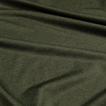 Close-up of dark green fabric with visible texture