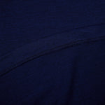 Close-up of dark blue fabric with a visible seam