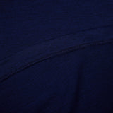 Close-up of dark blue fabric with a visible seam