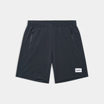 Black shorts with a brand label on a light gray background