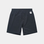 Black shorts with a small white logo on a light gray background