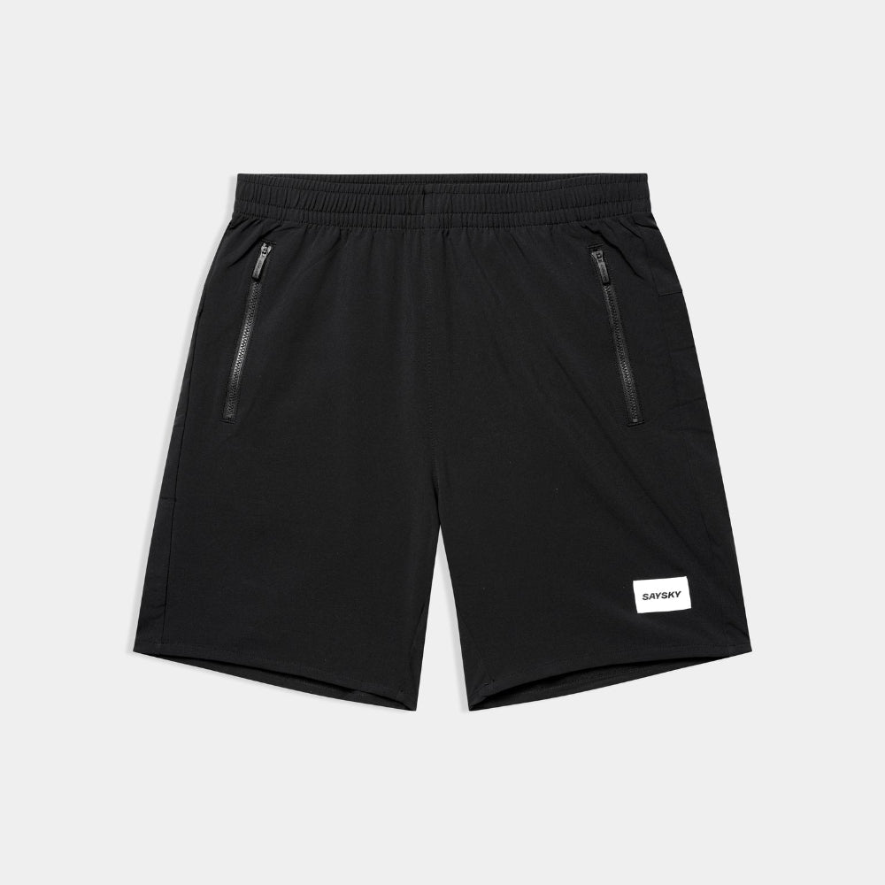 Black shorts with zippers on a light gray background