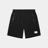 Black shorts with zippers on a light gray background