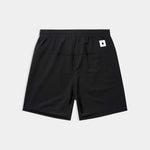 Black shorts with a small white logo on a light gray background