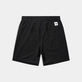 Black shorts with a small white logo on a light gray background