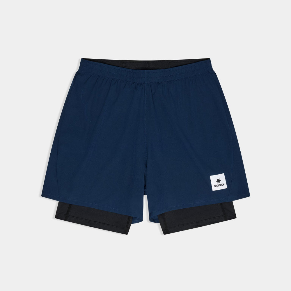 Navy blue athletic shorts with a brand logo on a light gray background