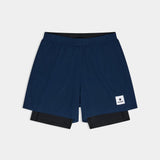 Navy blue athletic shorts with a brand logo on a light gray background