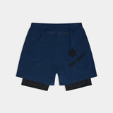 Blue athletic shorts with a star logo on a light gray background
