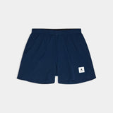 Navy blue shorts with a brand logo on a light gray background