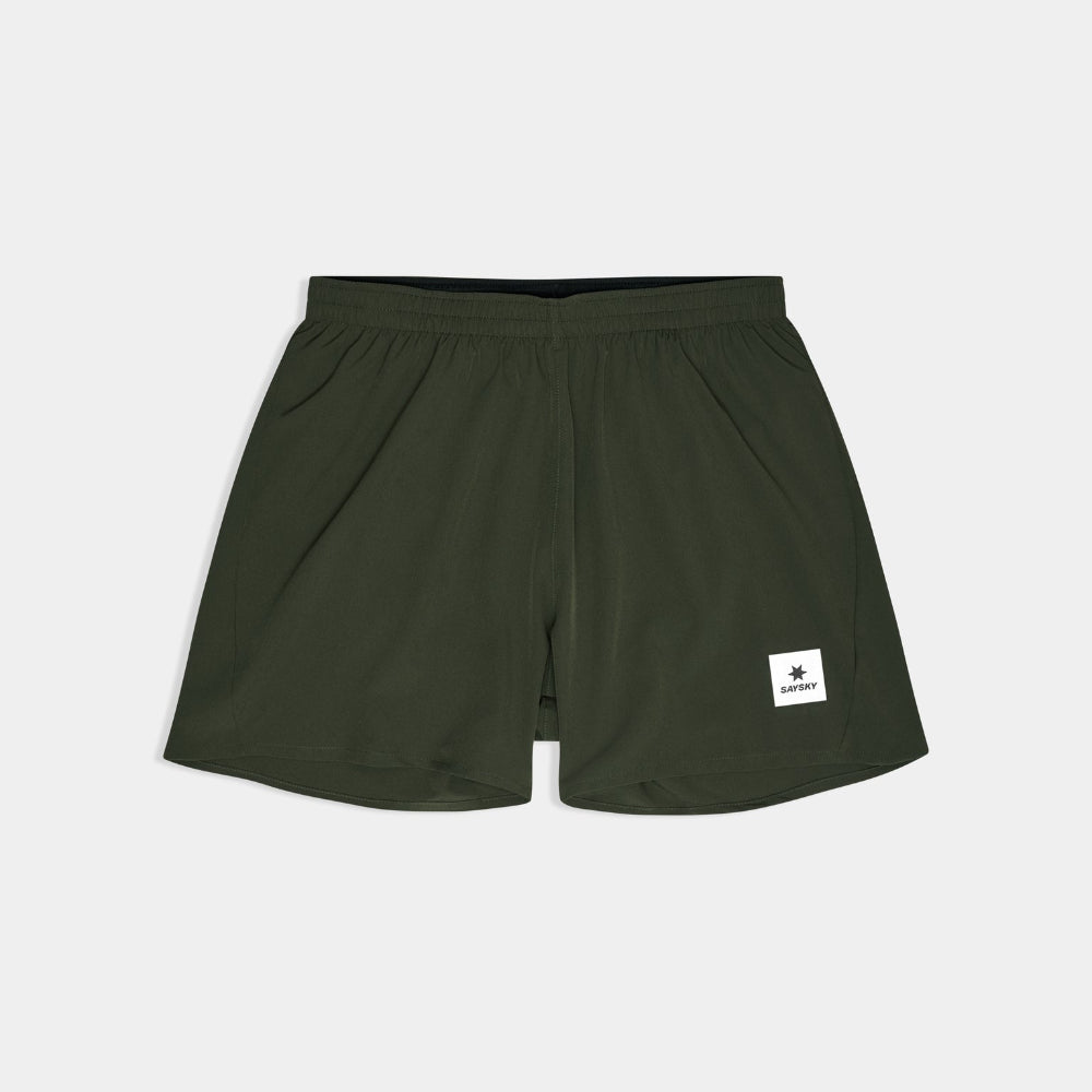 Green shorts with a brand logo on a light gray background
