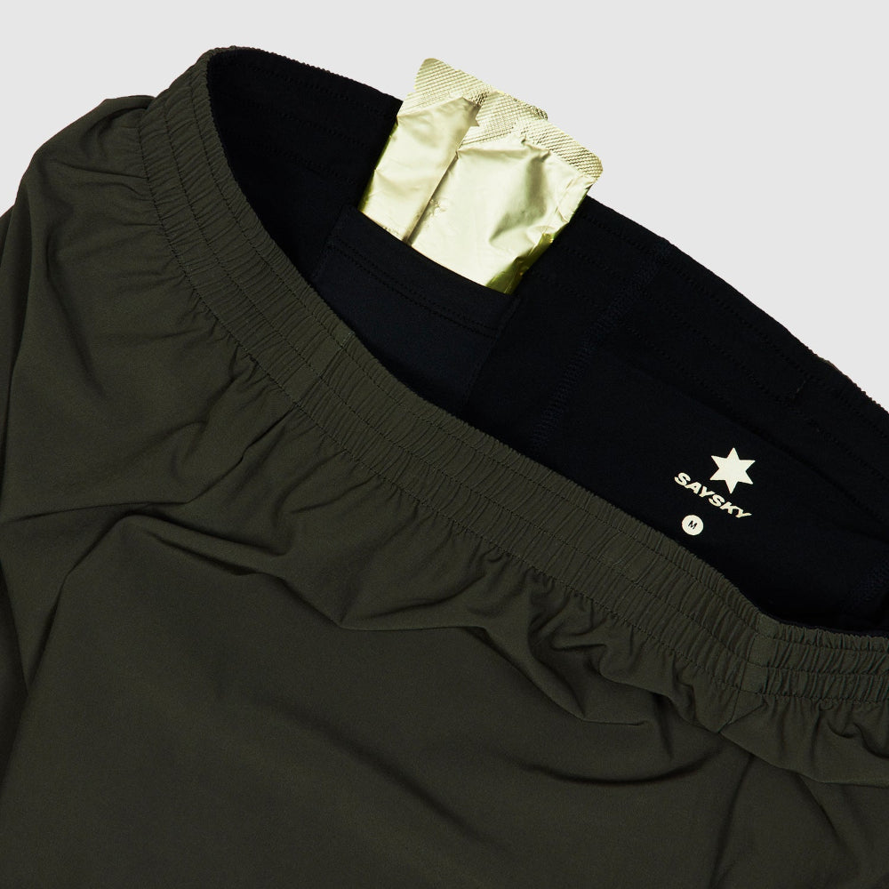 Black pants with a gold patch and Savsky logo on a light gray background