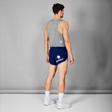 Person wearing a gray tank top and blue shorts with 'Saysky' branding on a gray background