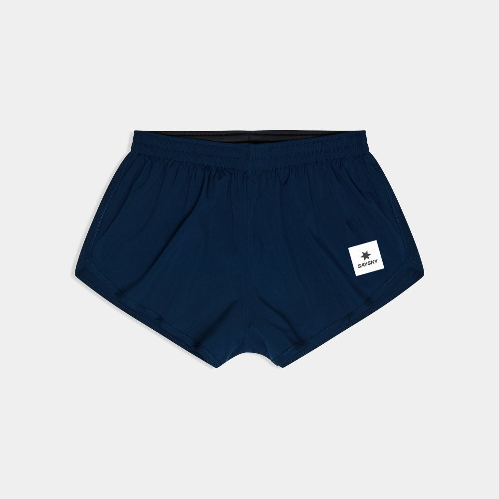 Navy blue shorts with a white logo on a light gray background