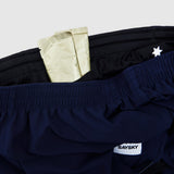 Navy shorts with a white star logo and 'Saysky' label on a light gray background