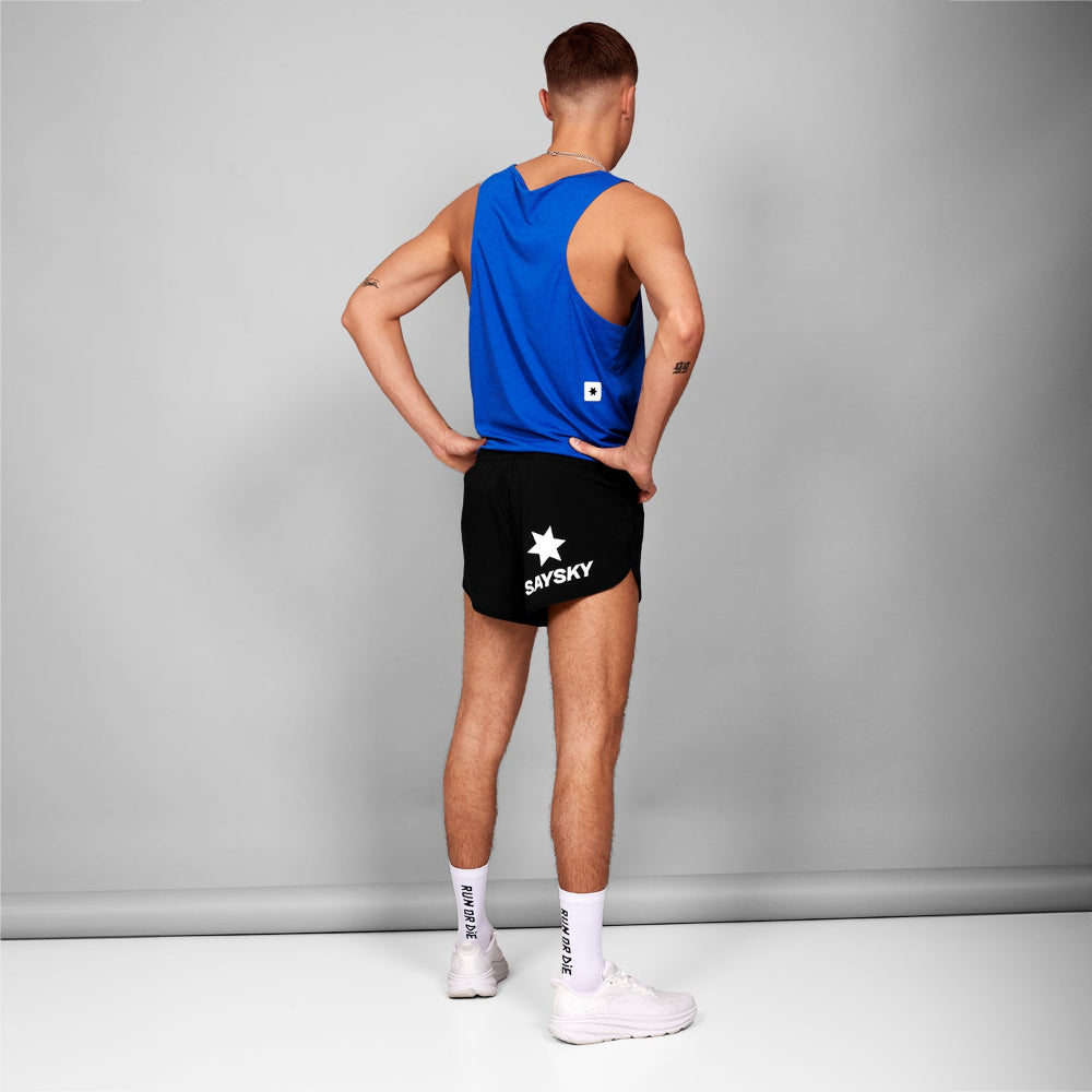 Person wearing a blue tank top and black shorts with 'Saysky' branding on a gray background